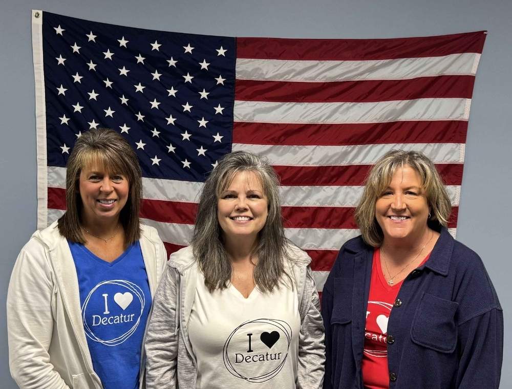 Deputy Clerk-Treasurer Wendi Gephart and Cherie Bienz, Clerk-Treasurer Eran Hackman